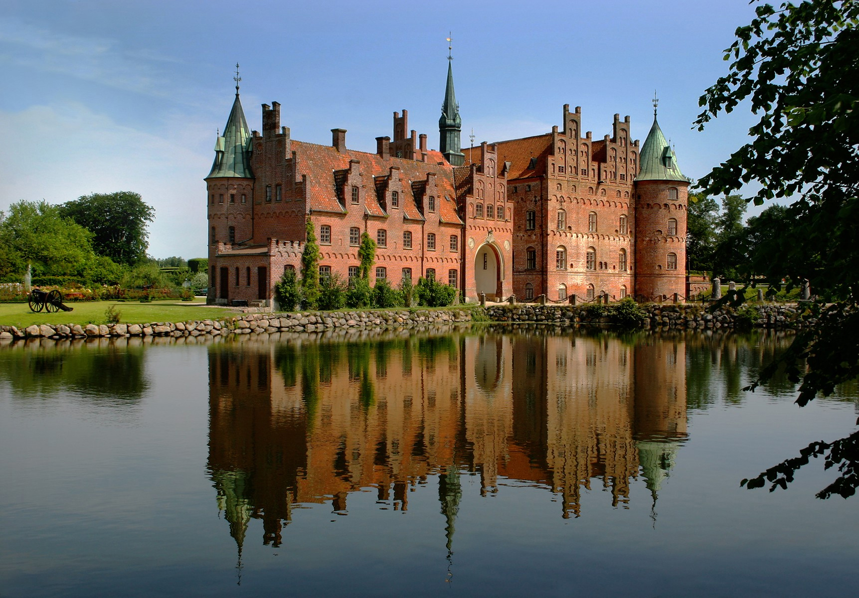 Egeskov Castle reflected in its moat on Funen